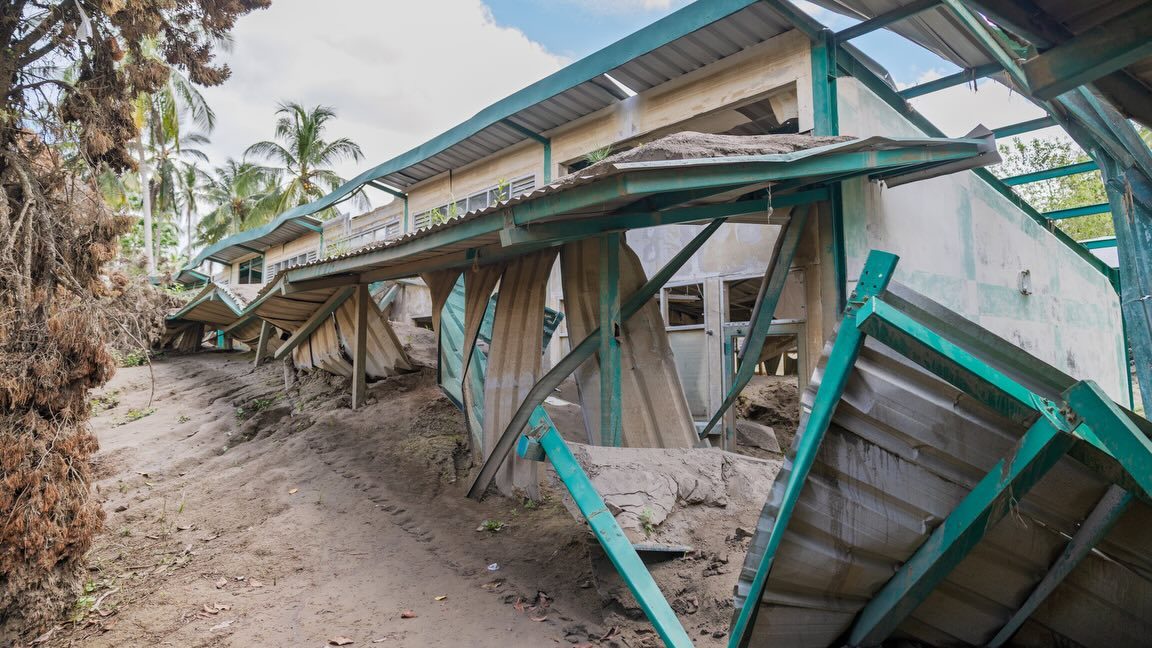 A building tilted by the floodwaters