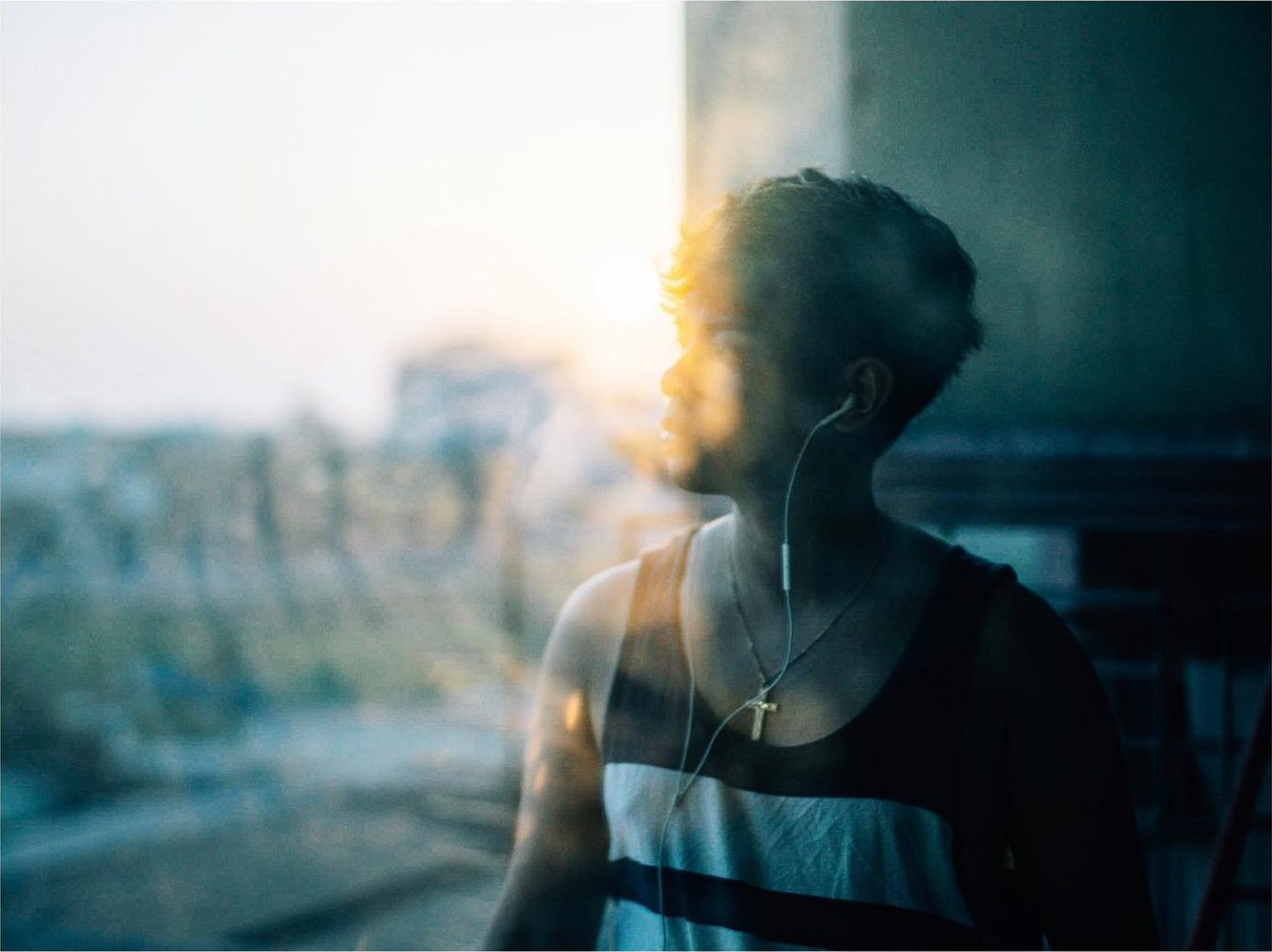 Narita Jun looking out of a window