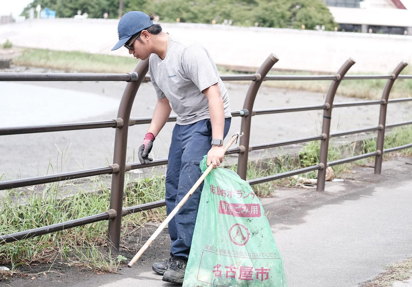 Volunteers picking up litter along the embankment