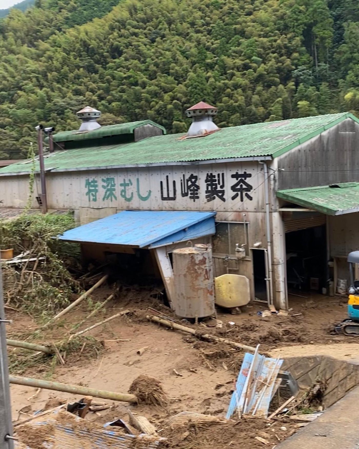 A tea factory filled with mud and debris