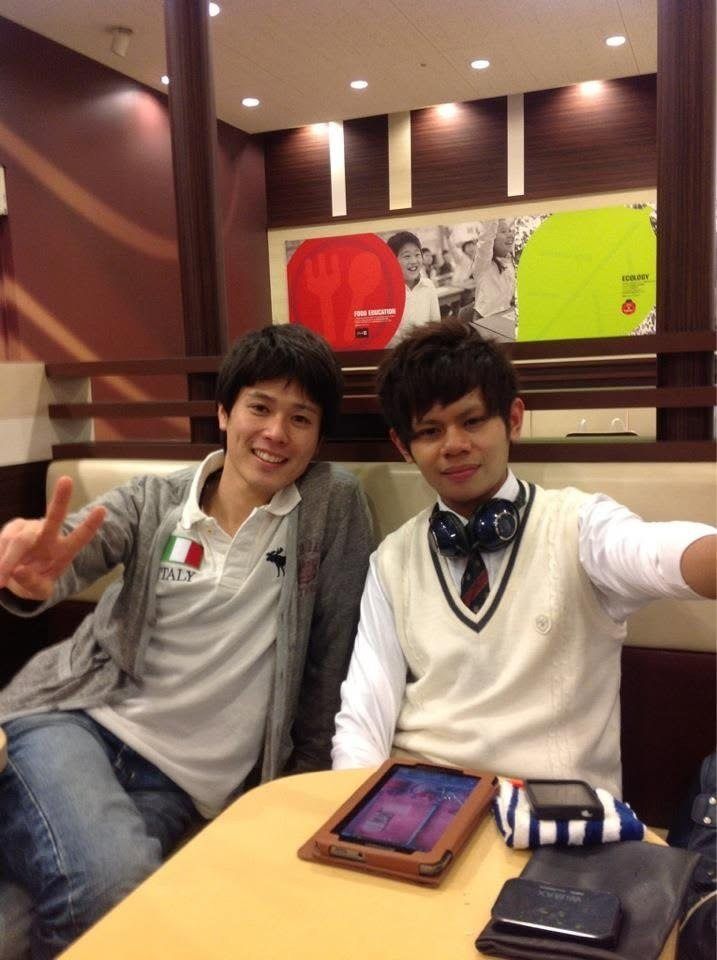 Narita Jun talking with people from church at a café
