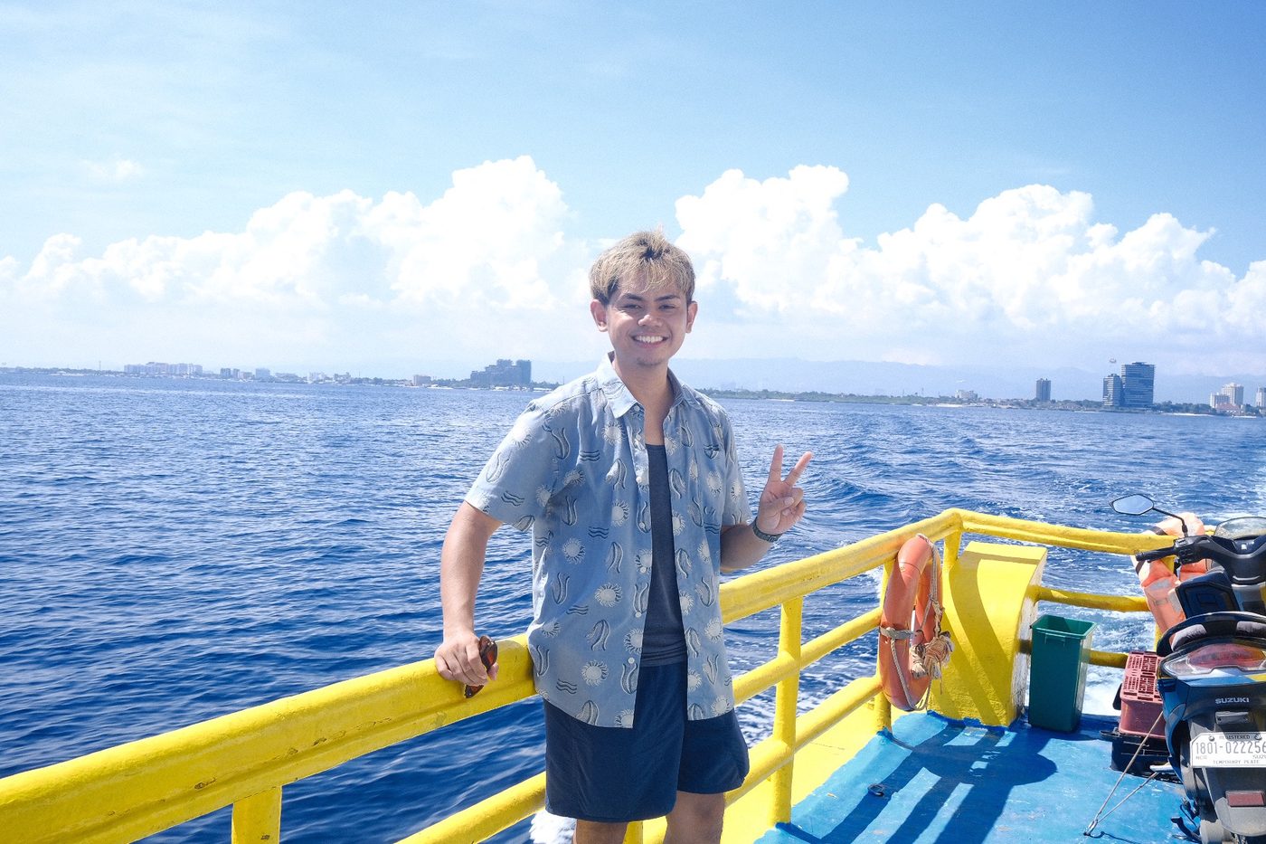 Narita Jun on a boat on the sea in the Philippines
